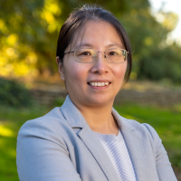 Yanhong Liu with a green nature background
